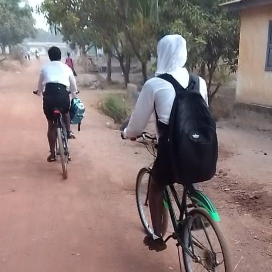 Children cycling to school on our bicycles